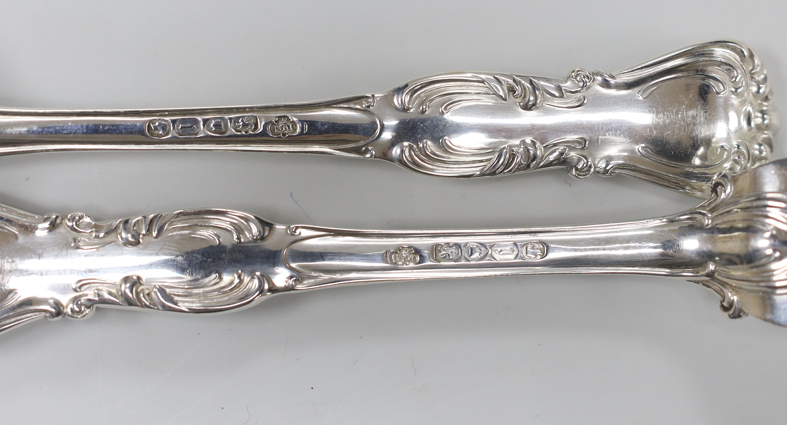 A set of six Victorian silver fancy pattern table spoons and four table forks by John Samuel Hunt, London, 1864 and two similar table forks by George Adams, London, 1848, 37.2oz.